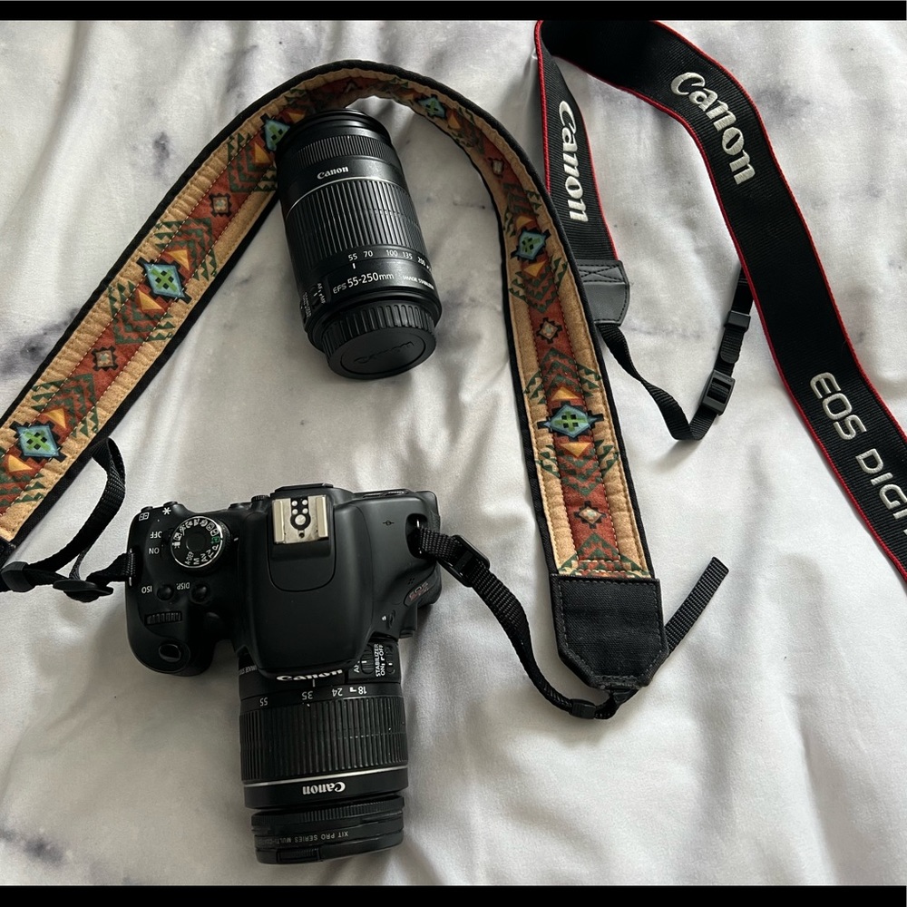 Canon EOS Rebel T3i camera with two lenses
